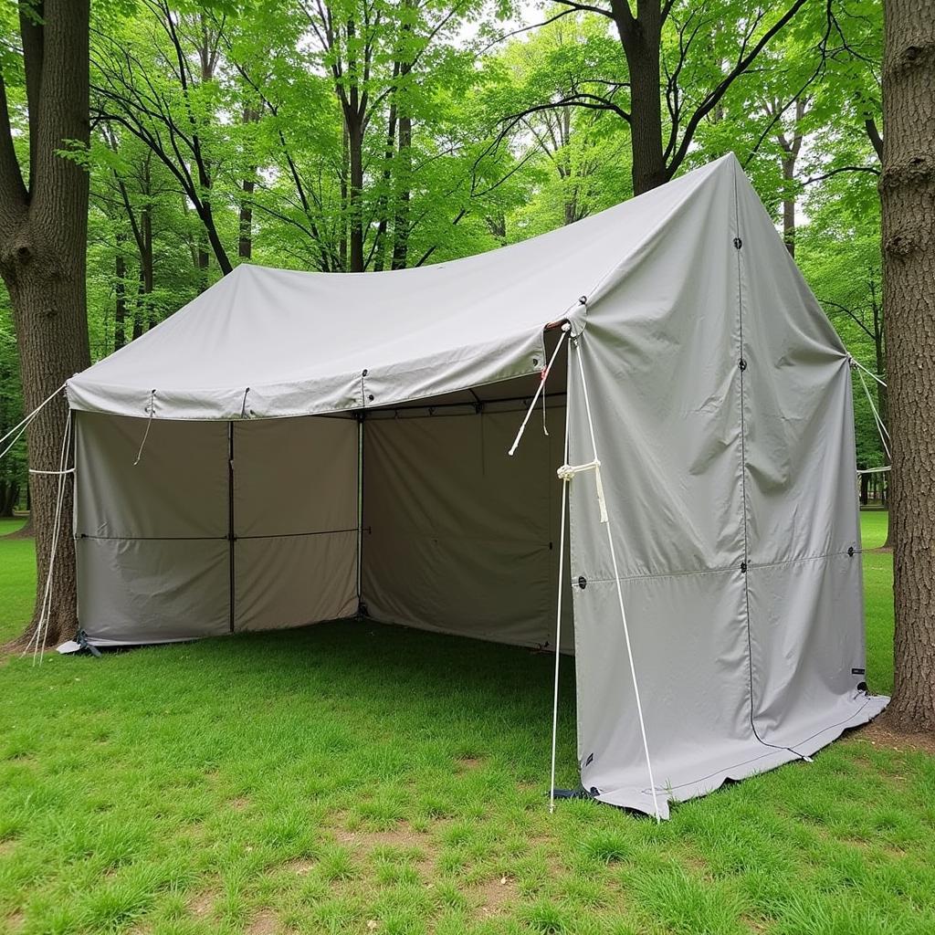 A 50x40 tarp with grommets set up as a temporary shelter during a camping trip.