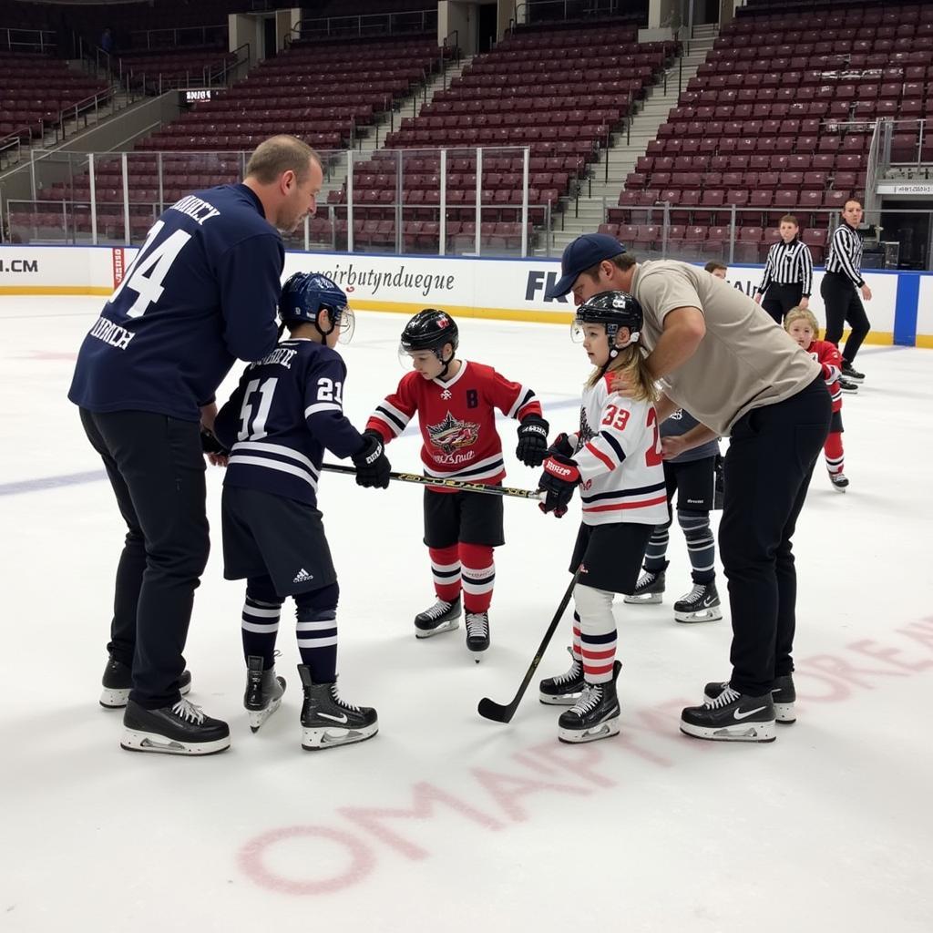 Young players participate in a Black Cat Hockey Tournament clinic