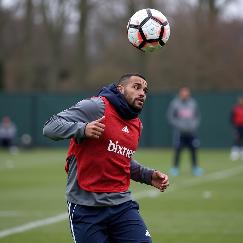 Footballer using chuck stop hat for header training