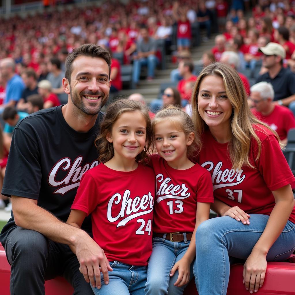 Family proudly wearing matching cheer shirts at a sporting event