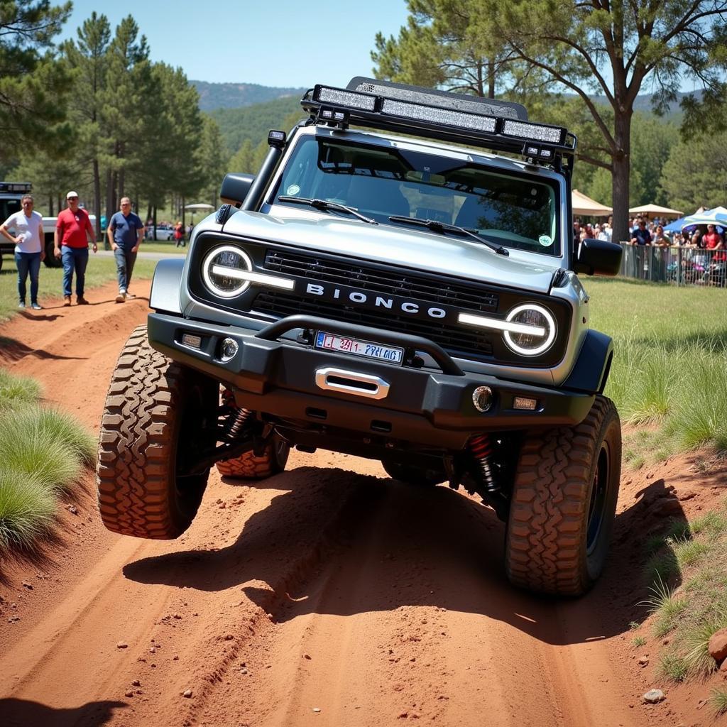 Ford Bronco tackling a challenging off-road course