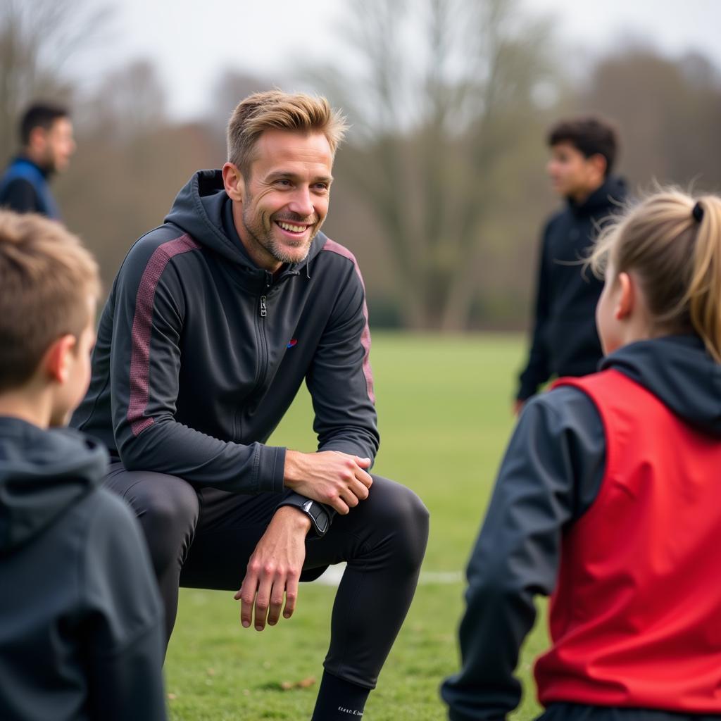 Frenkie de Jong coaching young players at a football camp