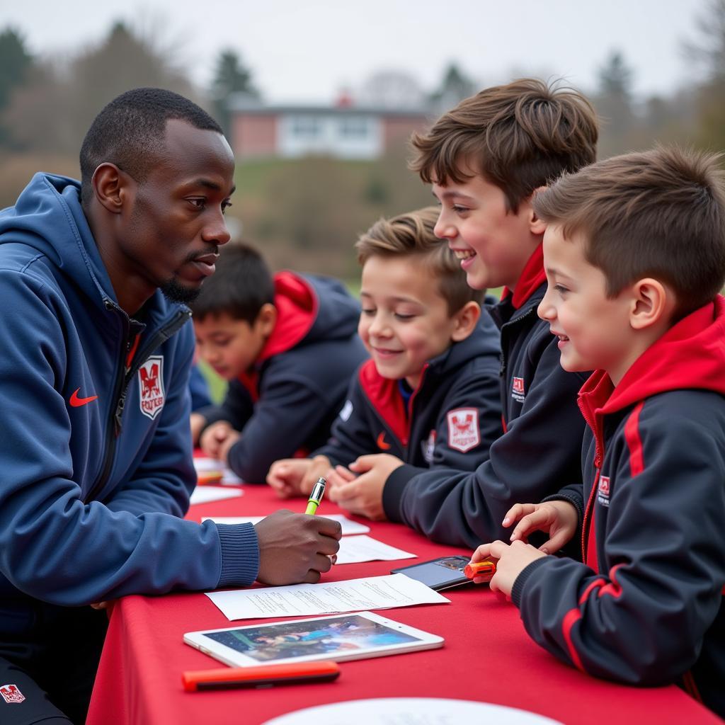 Frenkie de Jong signing autographs for young fans after a training session