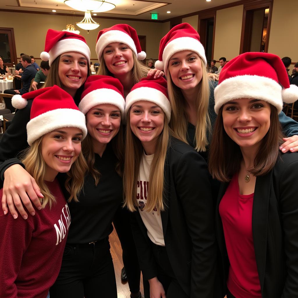 Friends wearing matching Michigan State Santa hats at a holiday party