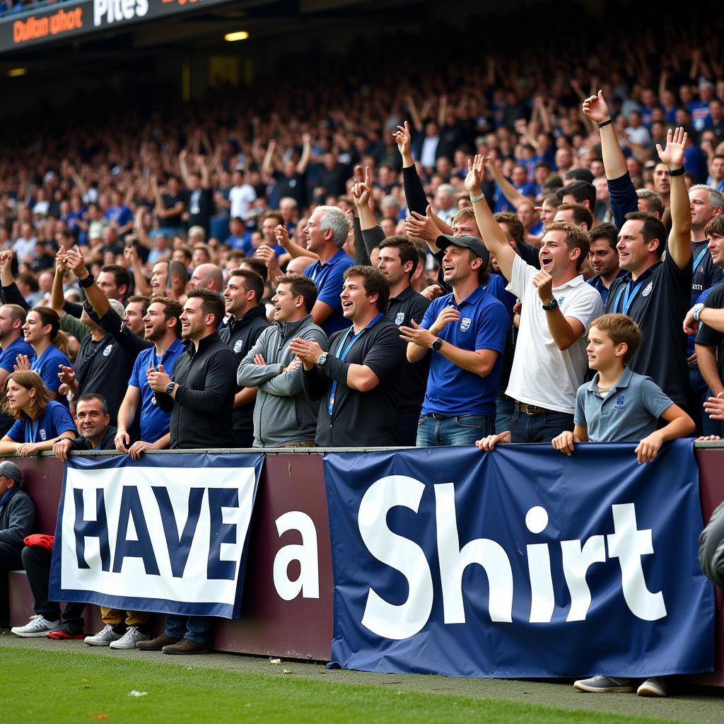 Fans celebrating a victory with "Have a Seat Shirt" signs