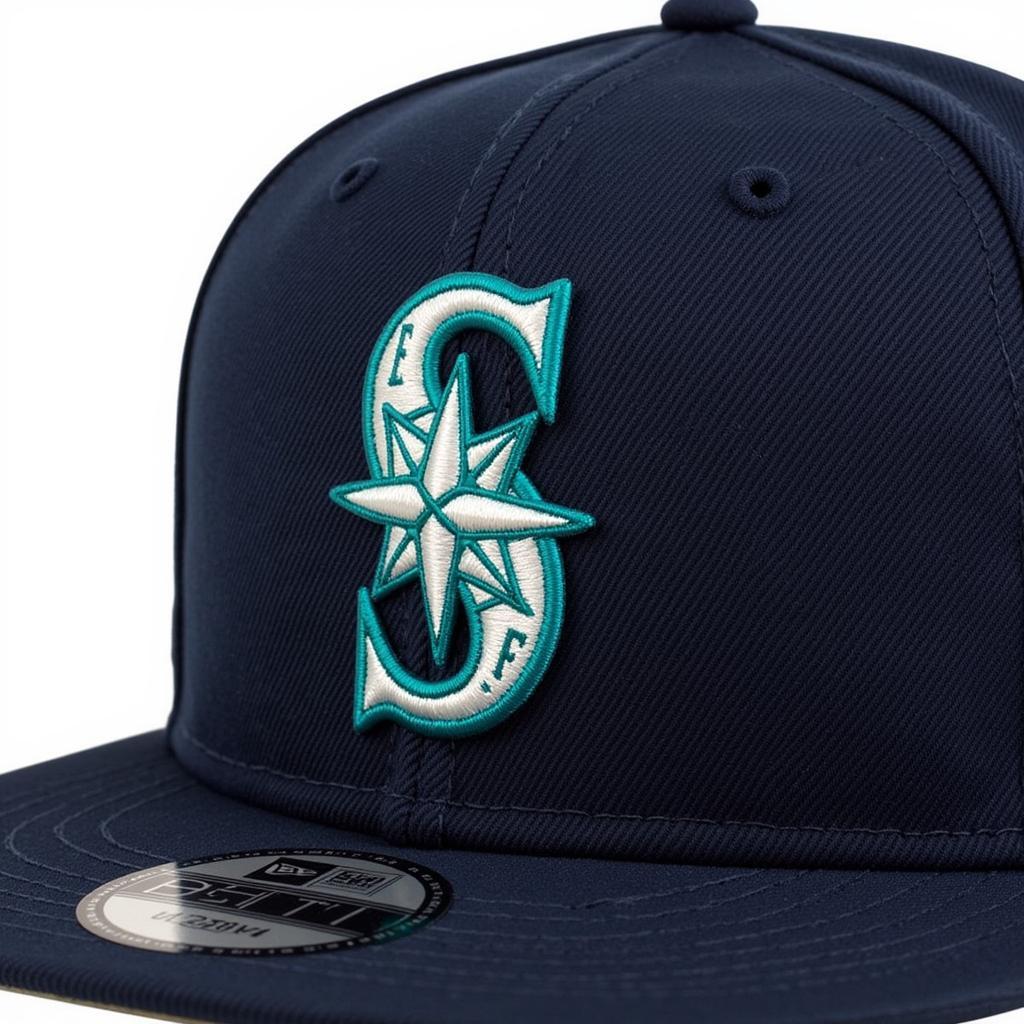 Close up of a Mariners fitted hat with a patch