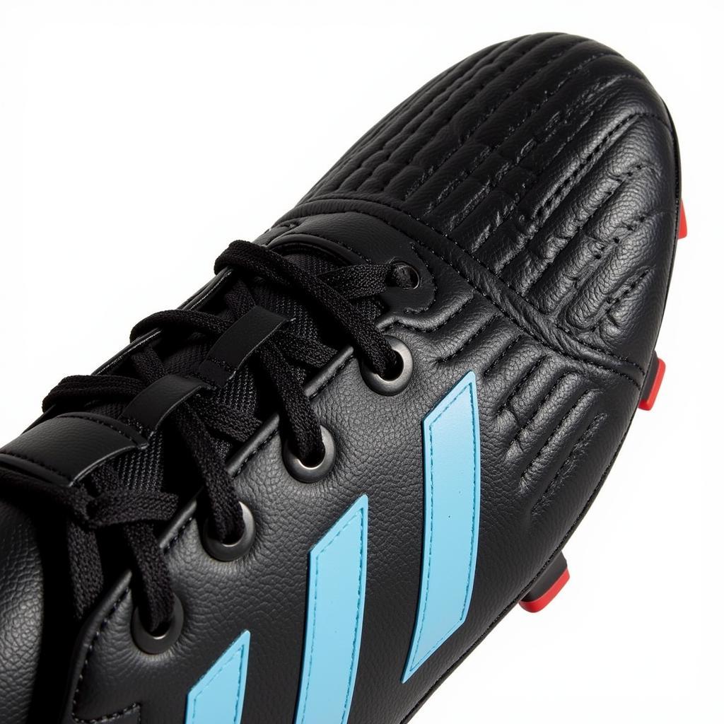 Close-up of Reynolds 3 football boots