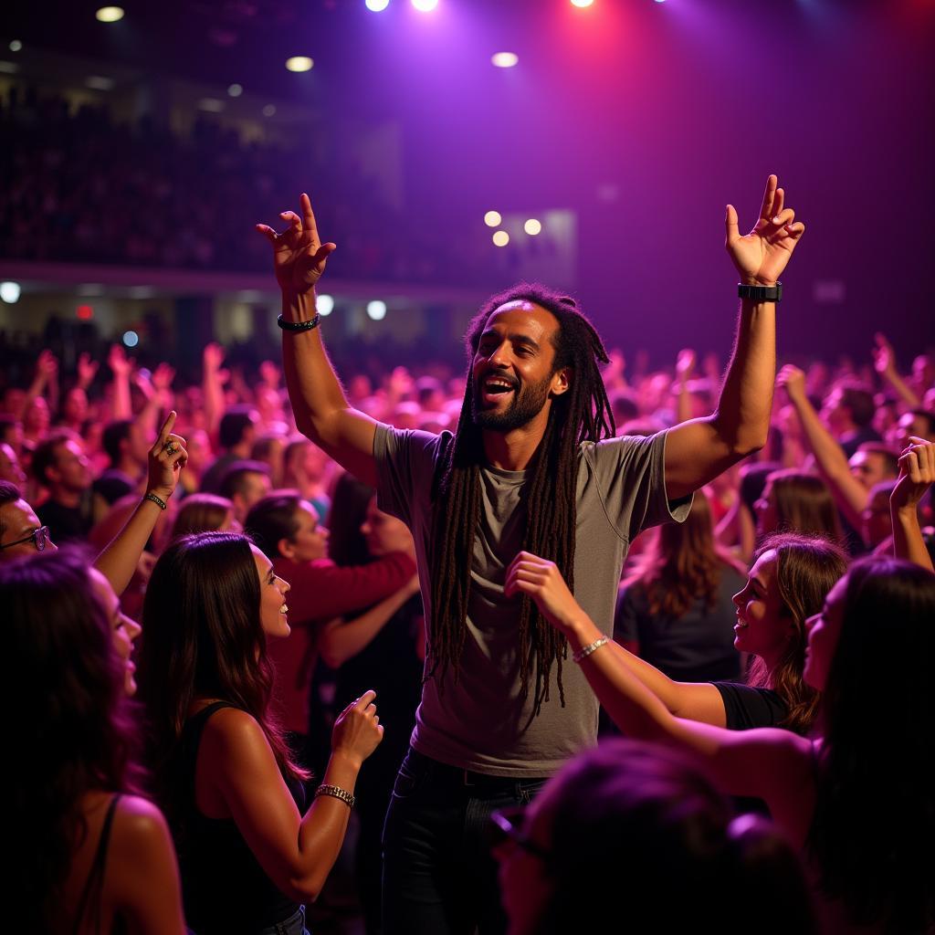 Excited fans cheering at a Ziggy Marley concert in San Diego