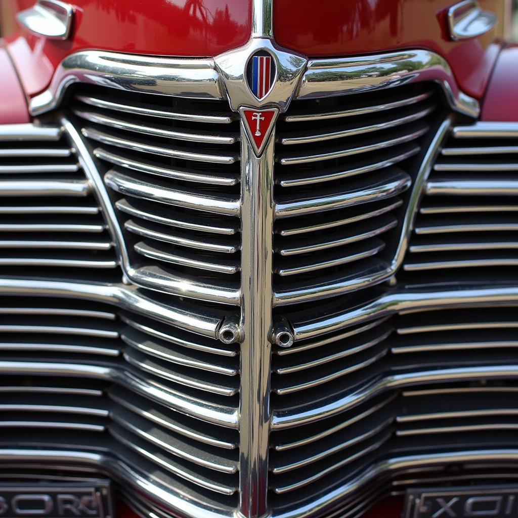 1940 Ford Deluxe Model Grill: Close-up view of the iconic three-part grille with chrome accents and distinctive center section