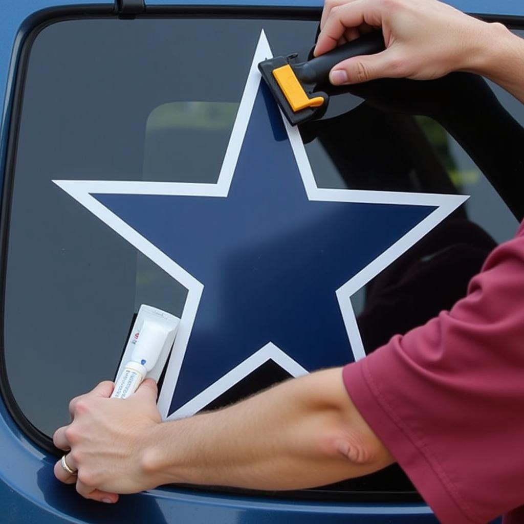 Applying a Cowboys Star Sticker to a Car Window