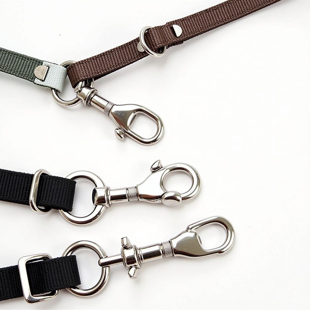 Dog lead splitter with strong metal clips attached to two dog collars