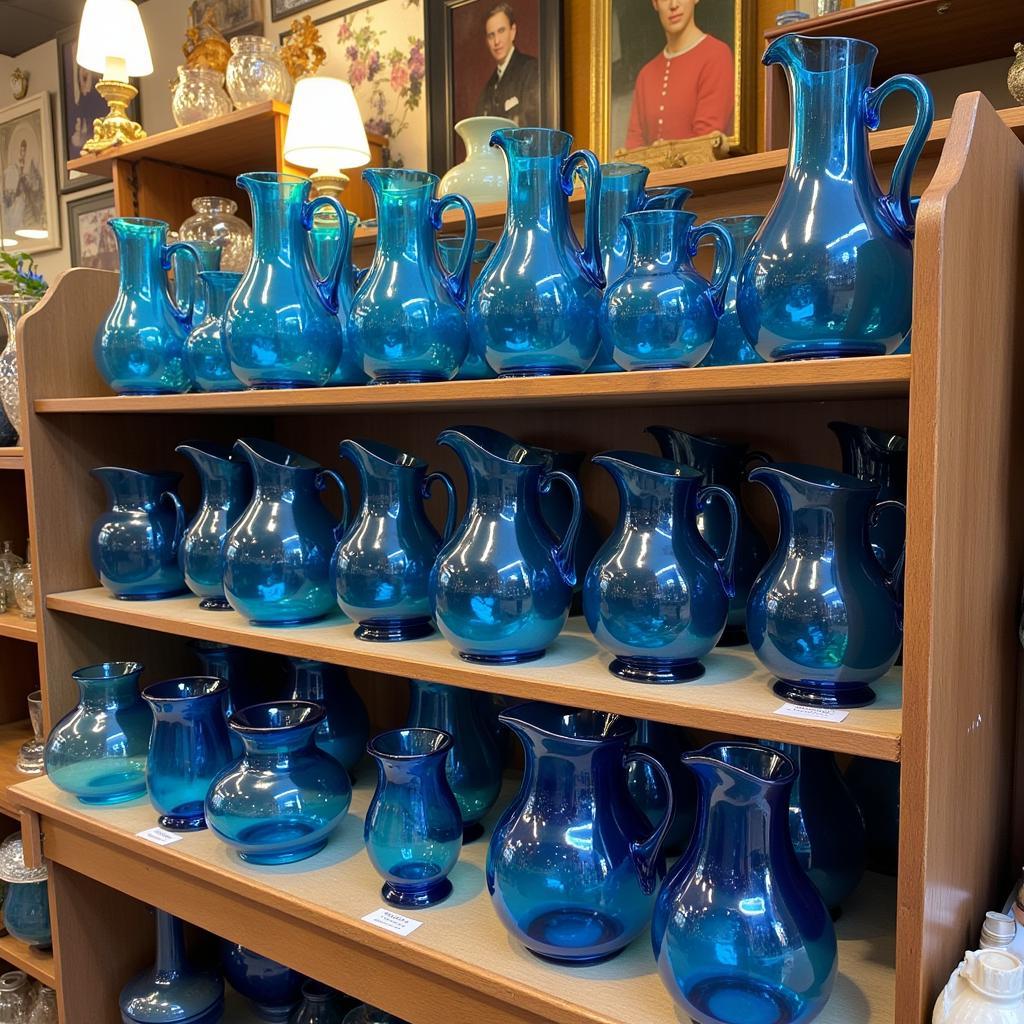 Fenton Blue Pitchers in an Antique Shop Display