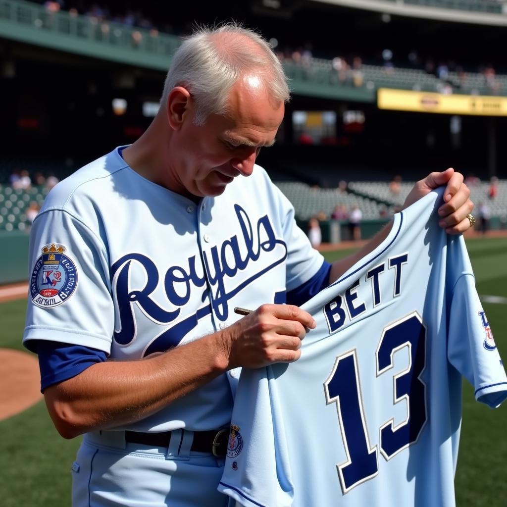 George Brett Signing a Jersey