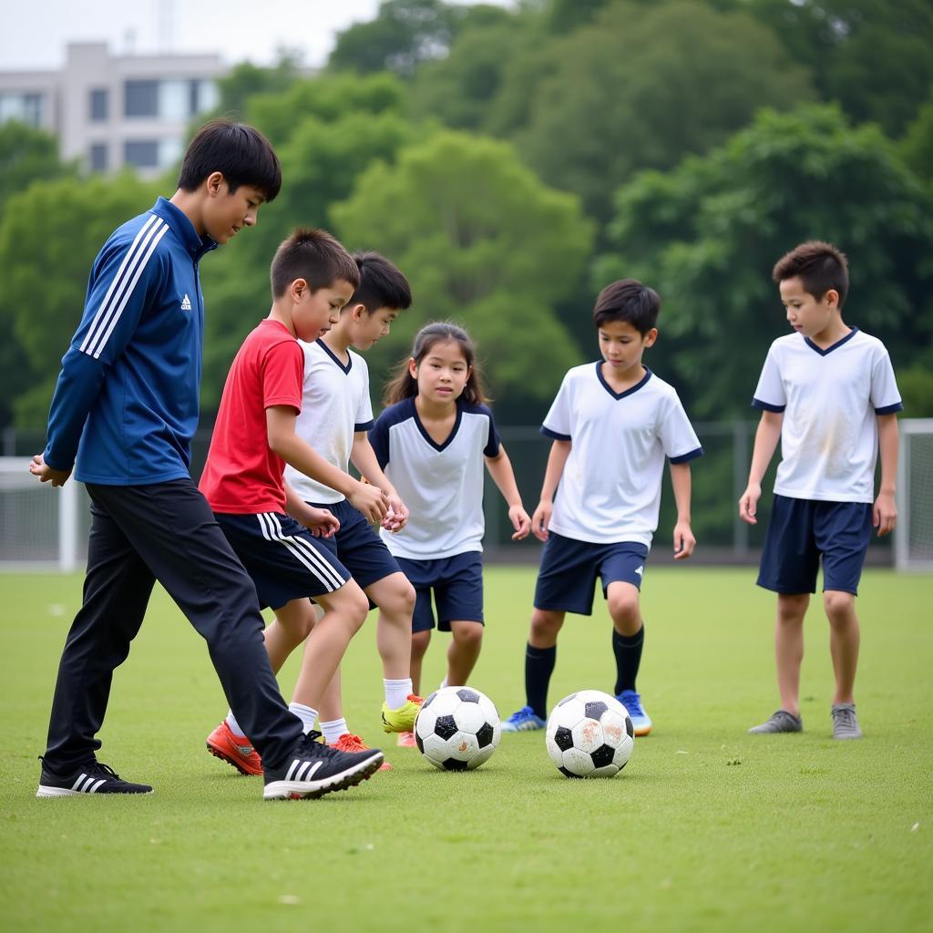 Young Japanese footballers practicing their skills during a training session