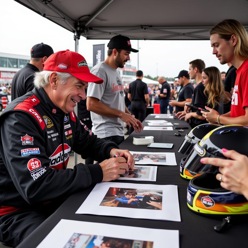 John Force signing autographs at an NHRA event