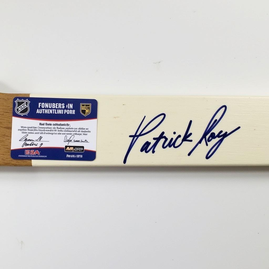 Patrick Roy autographed hockey stick with certificate of authenticity.