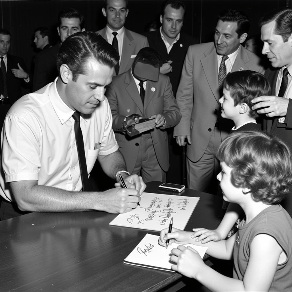 Phil Rizzuto Signing Autographs for Fans