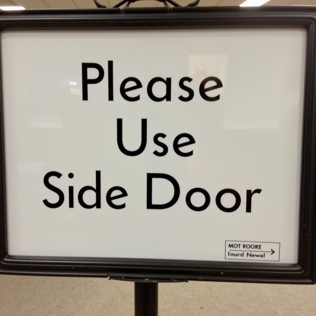 Example of a clear and concise "Please Use Side Door" sign