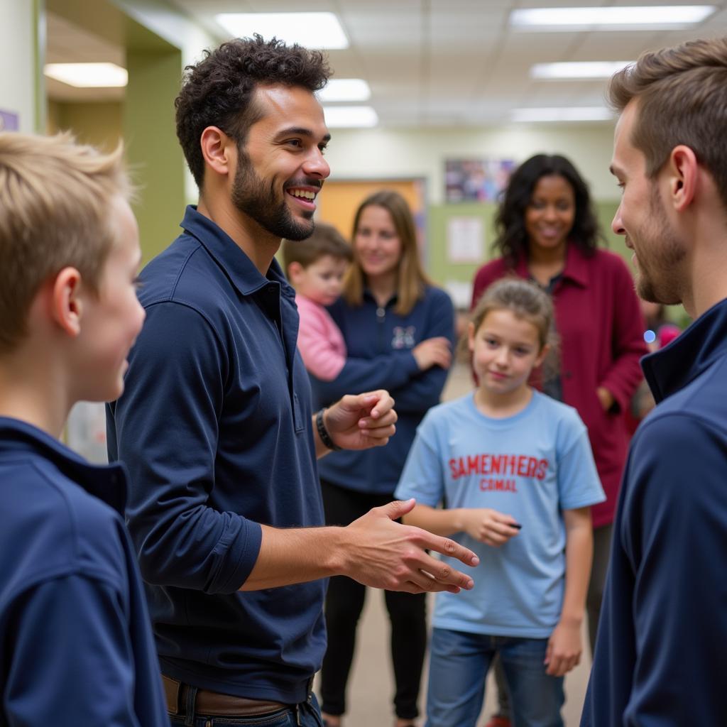 Trey Hendrickson participating in community events, demonstrating his commitment to giving back.