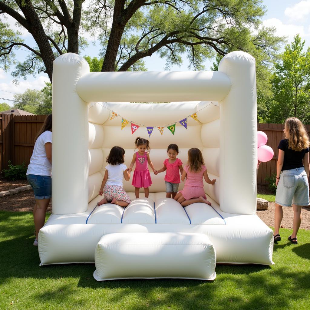 White Bounce House Rental at a San Antonio Party