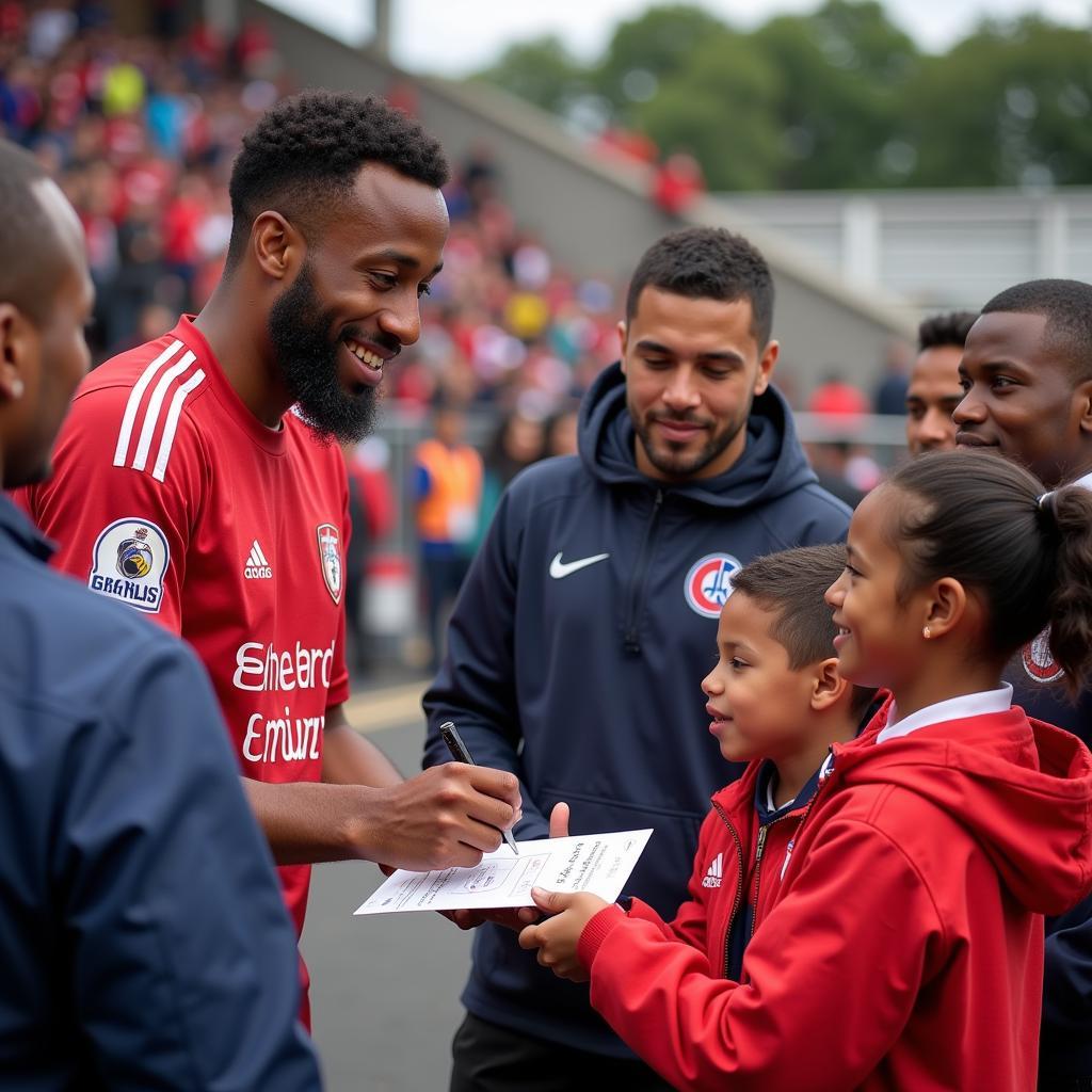 A football player interacting with fans after a match