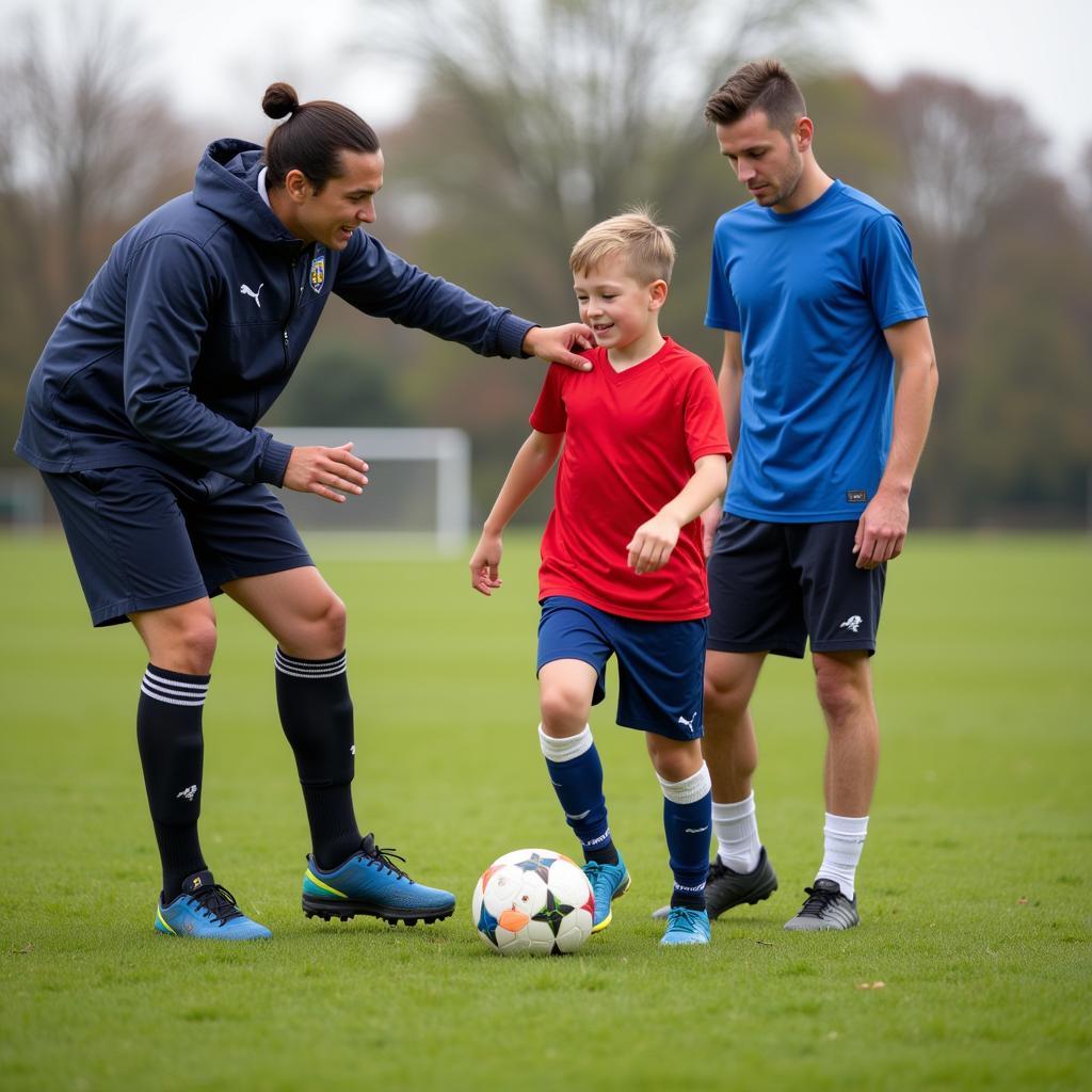 A parent and coach offering encouragement and support to a young football player.