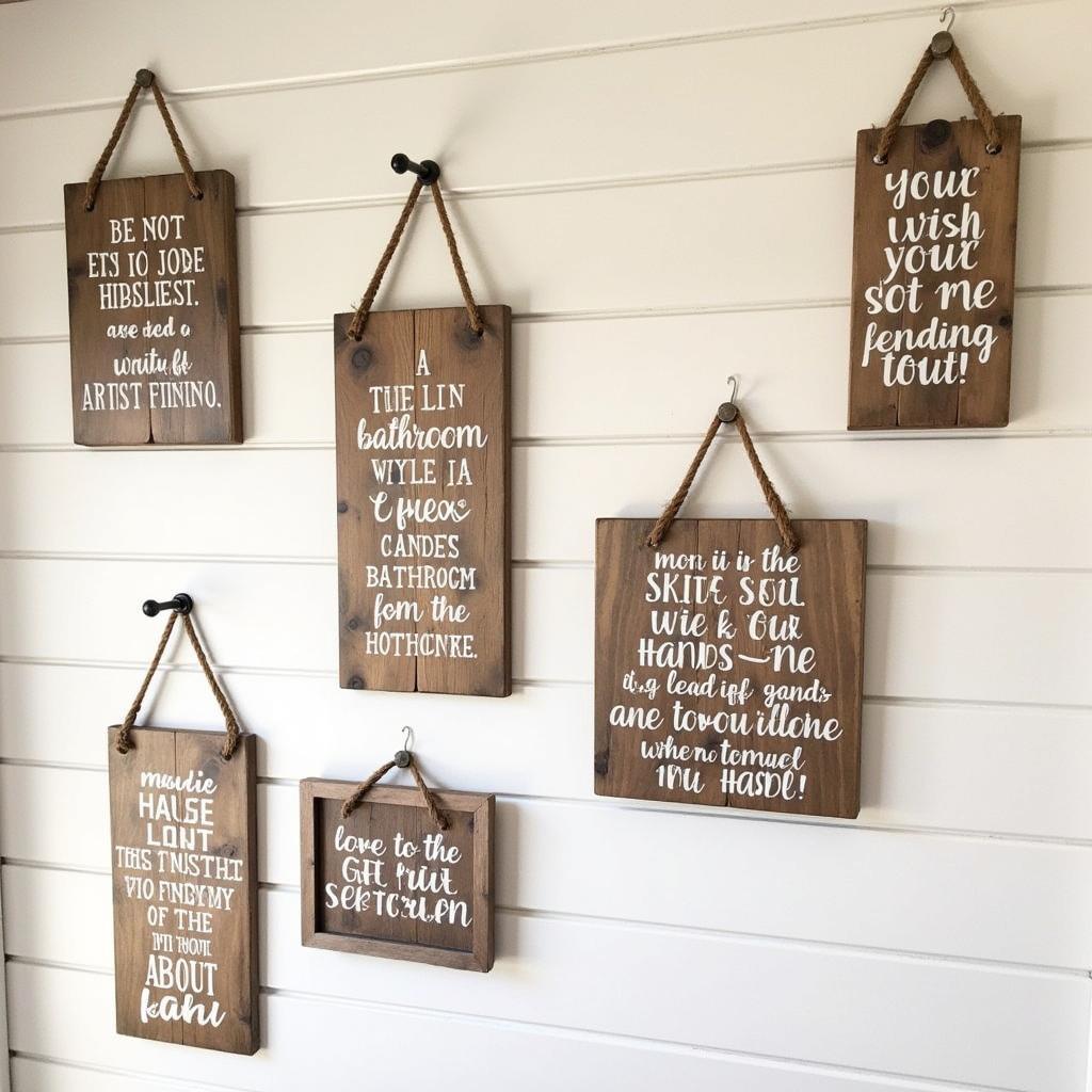 Rustic wooden bathroom plaques with funny sayings hanging on a bathroom wall.