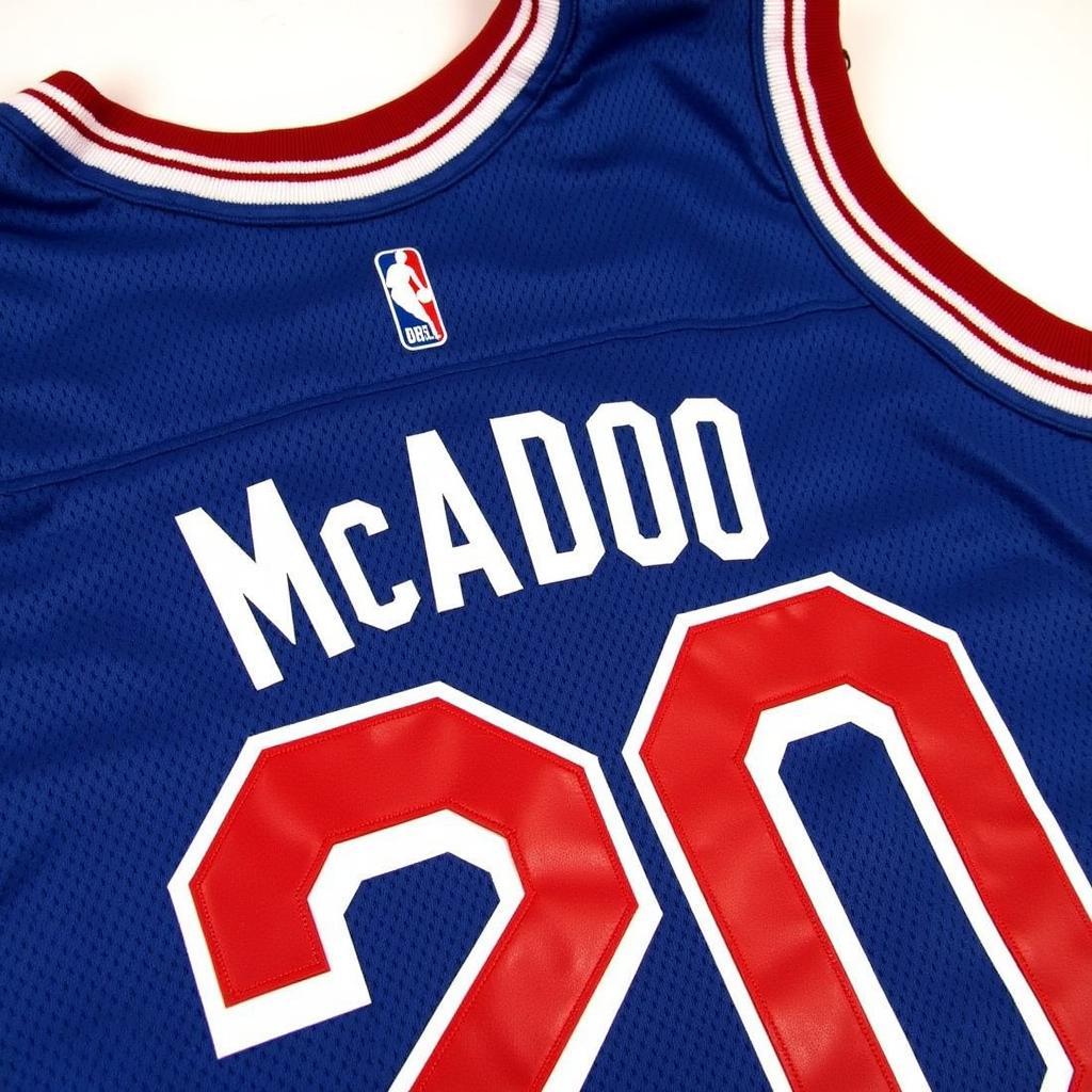 A vintage Buffalo Braves jersey featuring Bob McAdoo's name and number.